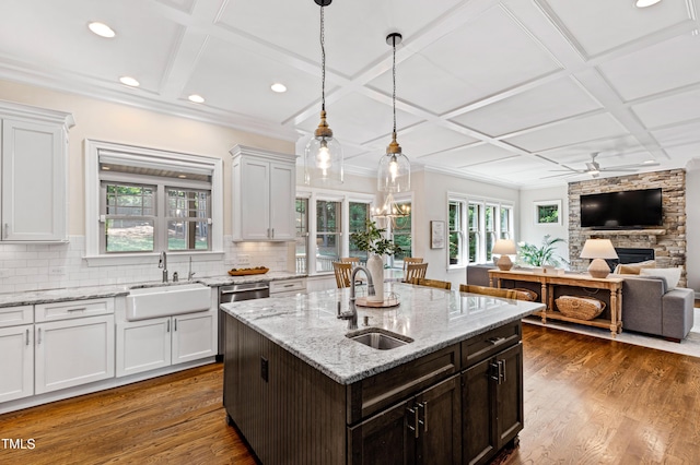 3209 Bryant Falls Ct, Raleigh, NC 27613 - kitchen featuring a sink, coffered ceiling, backsplash, dark wood-type flooring, and a ceiling fan