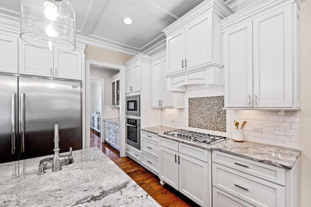 3209 Bryant Falls Ct, Raleigh, NC 27613 - kitchen with built in appliances, white cabinets, decorative backsplash, light stone counters, and a sink