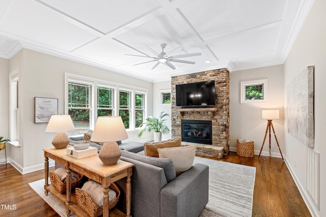 3209 Bryant Falls Ct, Raleigh, NC 27613 - living room featuring a stone fireplace, plenty of natural light, baseboards, coffered ceiling, and wood finished floors
