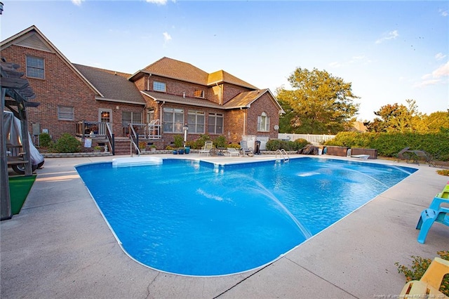 view of swimming pool with a patio