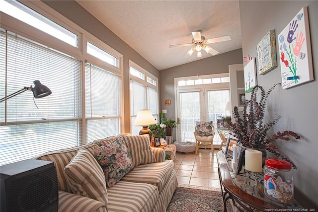 sunroom featuring vaulted ceiling and ceiling fan