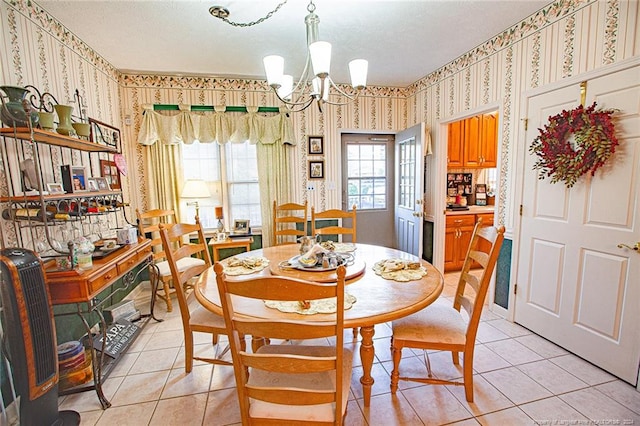 dining room featuring light tile patterned floors, a textured ceiling, and a chandelier