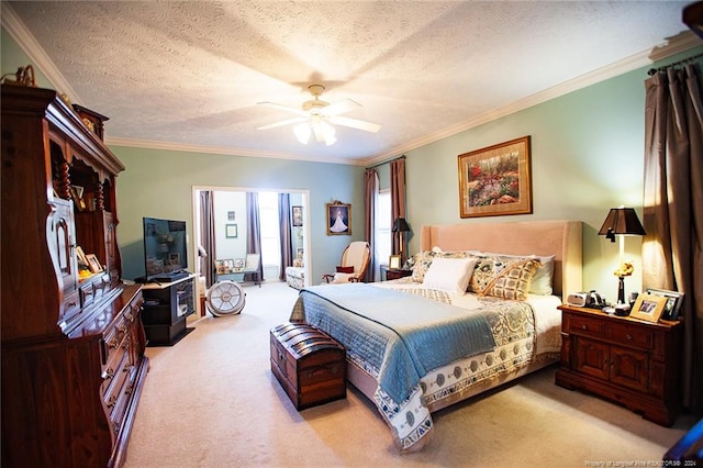 carpeted bedroom featuring crown molding, ceiling fan, and a textured ceiling