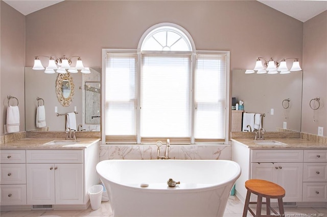 bathroom with vanity, lofted ceiling, and separate shower and tub