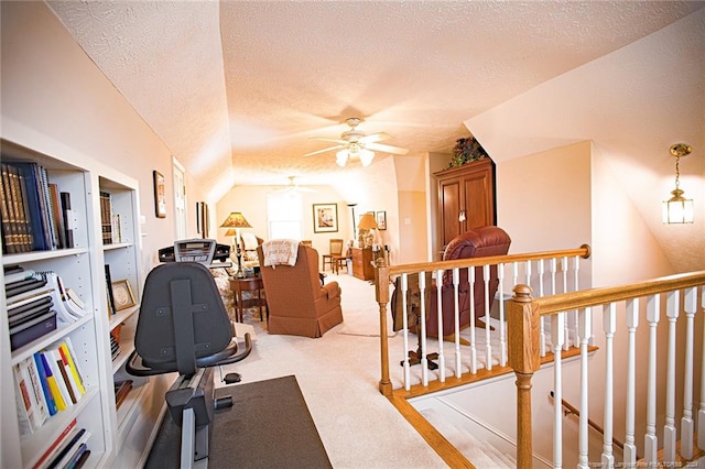 home office featuring a textured ceiling, light colored carpet, and ceiling fan