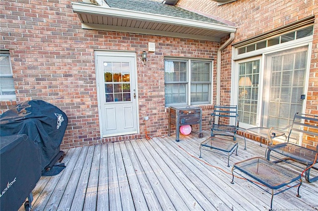 wooden terrace with area for grilling