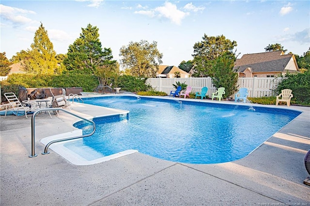 view of pool with a patio area and pool water feature