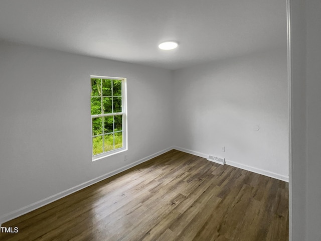 unfurnished room featuring wood-type flooring