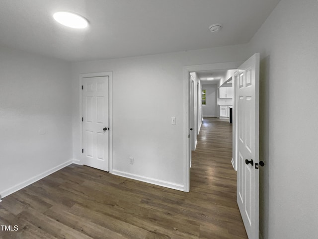 empty room featuring dark hardwood / wood-style floors