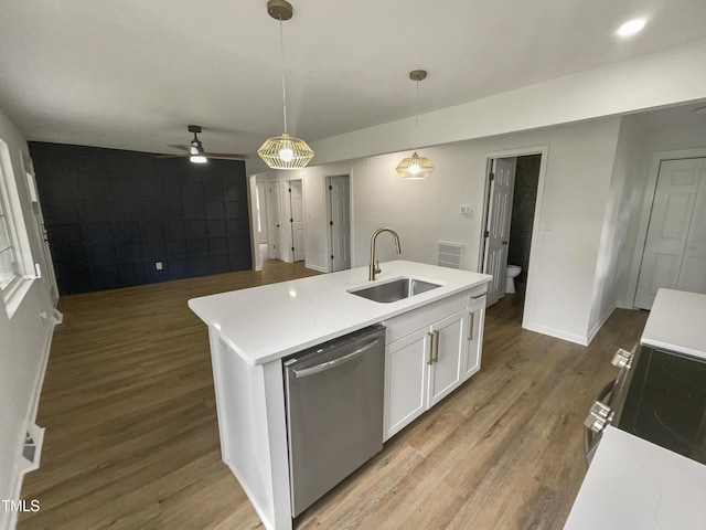 kitchen featuring dishwasher, sink, decorative light fixtures, a center island with sink, and white cabinets