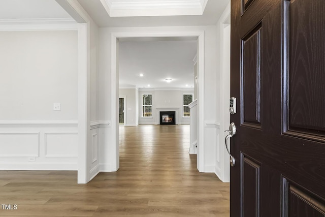 foyer entrance featuring hardwood / wood-style flooring and ornamental molding