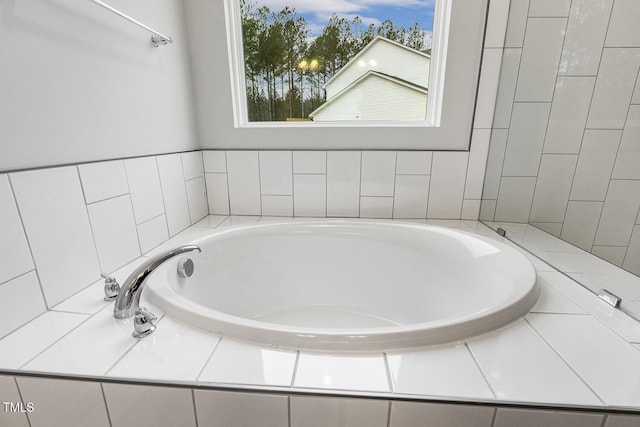 bathroom with tiled tub