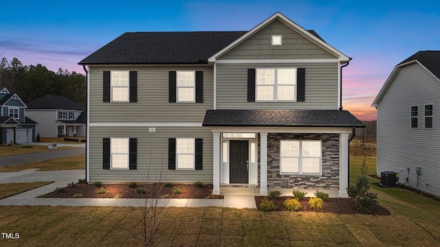 535 Husketh Rd, Youngsville, NC 27596 - view of front facade with a lawn, roof with shingles, and stone siding