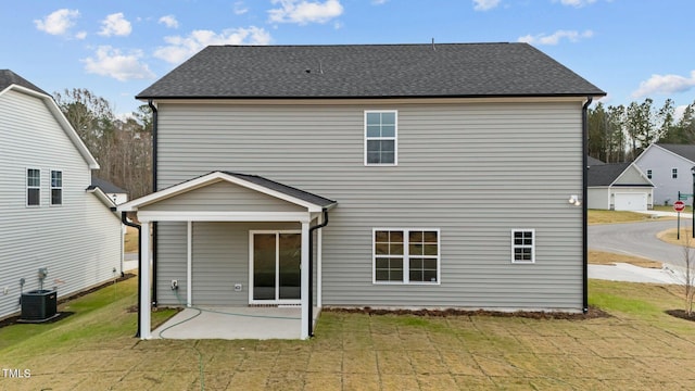 535 Husketh Rd, Youngsville, NC 27596 - back of property featuring a patio area, a lawn, and roof with shingles