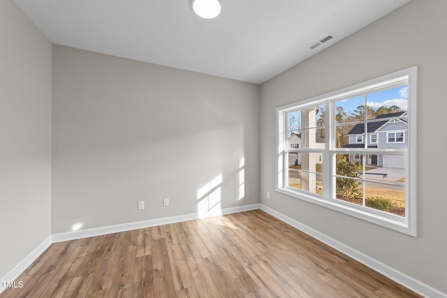 empty room with light hardwood / wood-style floors