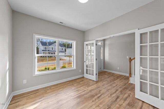 535 Husketh Rd, Youngsville, NC 27596 - unfurnished room featuring french doors and wood finished floors