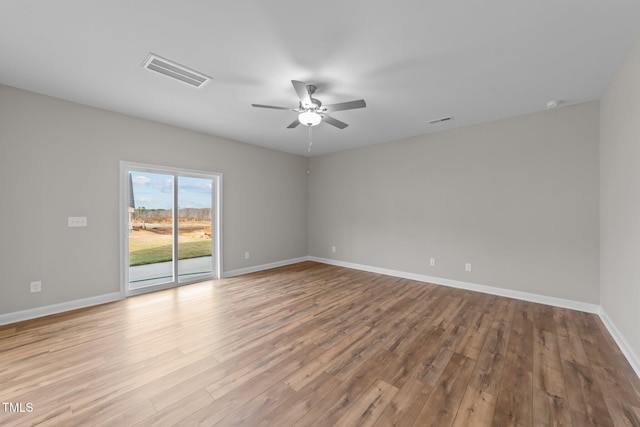 unfurnished room featuring light hardwood / wood-style floors and ceiling fan