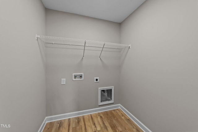 laundry room featuring hardwood / wood-style floors, hookup for an electric dryer, and hookup for a washing machine