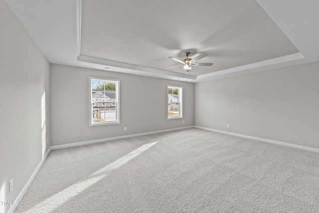 535 Husketh Rd, Youngsville, NC 27596 - unfurnished room with a tray ceiling, a ceiling fan, and carpet flooring