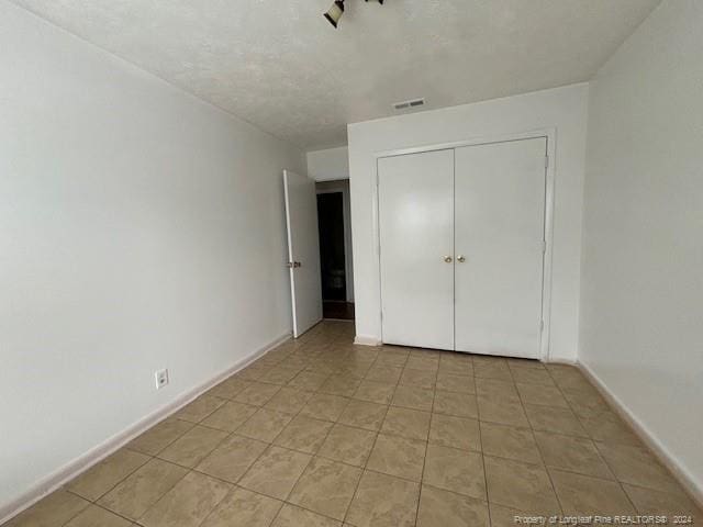 unfurnished bedroom featuring a closet