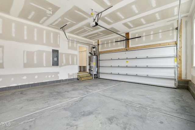 garage featuring a garage door opener, electric panel, and water heater