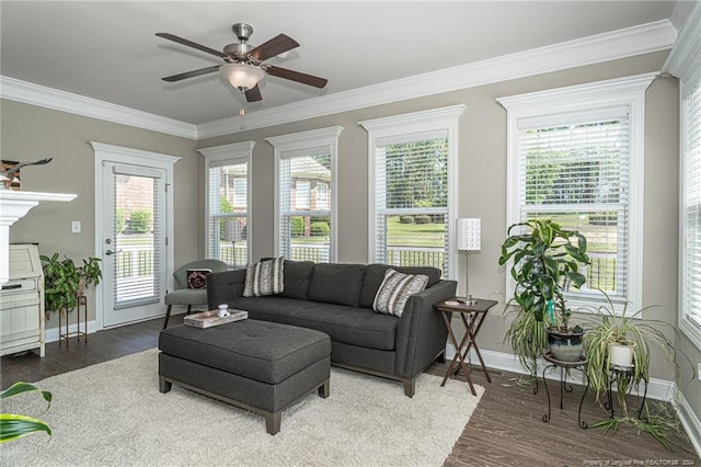 living room with ceiling fan, wood-type flooring, and crown molding