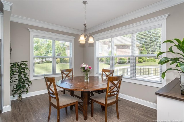 dining area with dark wood-type flooring and ornamental molding