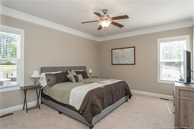 bedroom featuring ceiling fan, light colored carpet, and ornamental molding