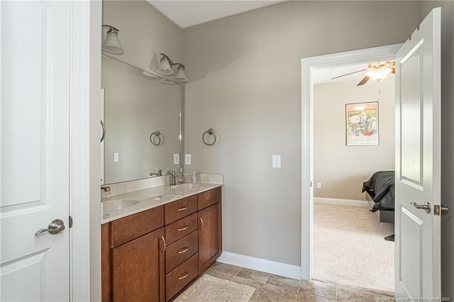 bathroom featuring ceiling fan and vanity