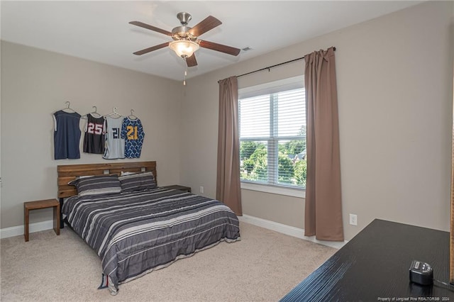 bedroom with light carpet and ceiling fan