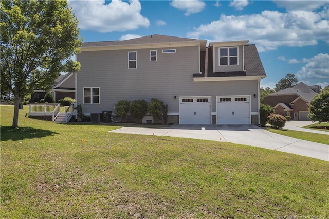 view of home's exterior with a garage, a lawn, and central air condition unit