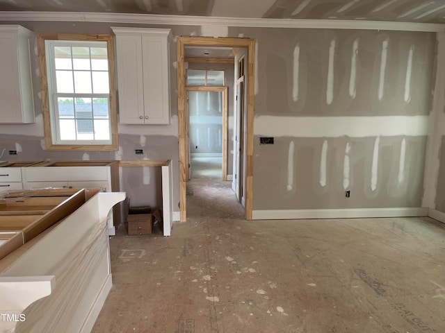 kitchen with white cabinets and ornamental molding