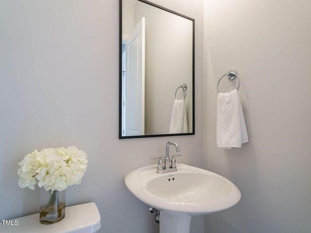 bathroom with sink and toilet