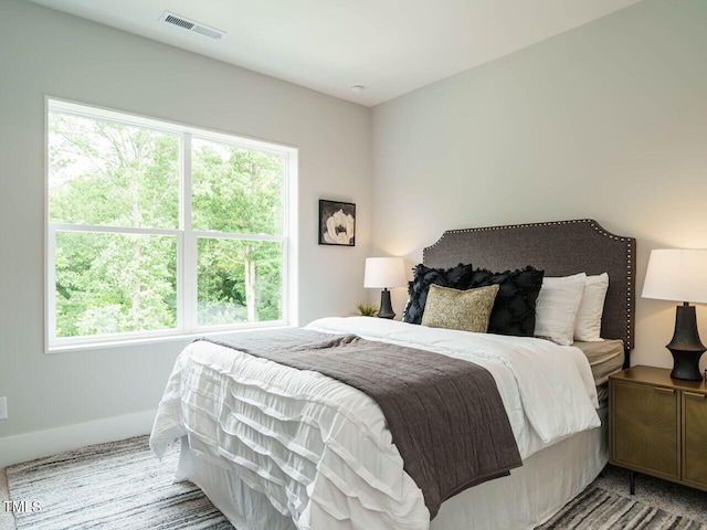 bedroom with multiple windows