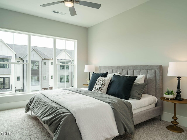 carpeted bedroom with ceiling fan