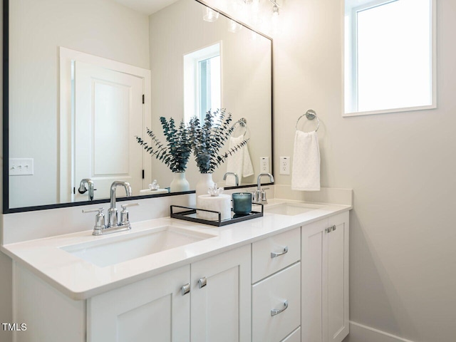 bathroom with vanity and a wealth of natural light