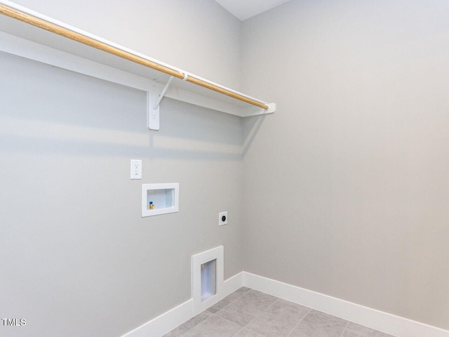 laundry room featuring hookup for a washing machine, electric dryer hookup, and light tile patterned floors