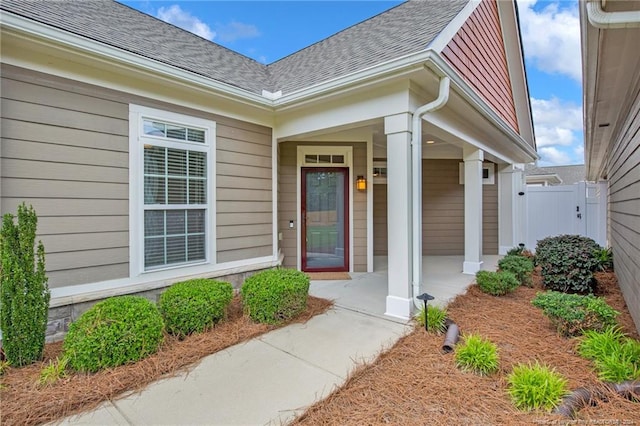 view of exterior entry with covered porch