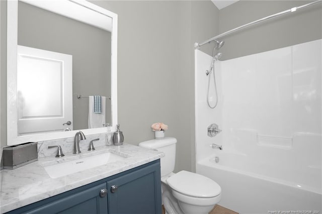 full bathroom featuring vanity, toilet, and shower / tub combination