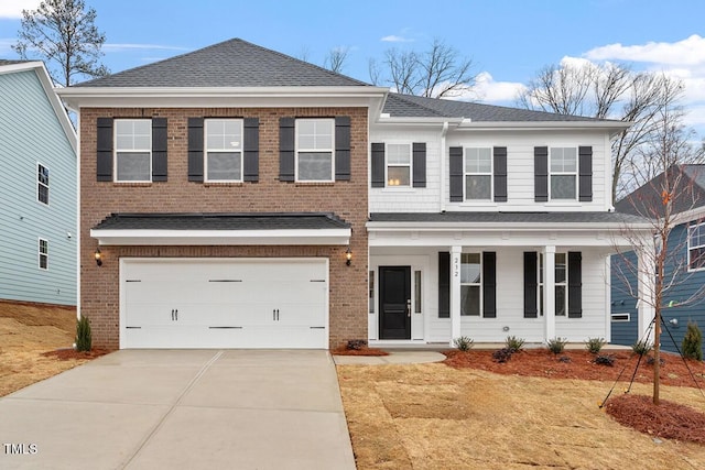 view of front of house with a porch, concrete driveway, brick siding, and a garage