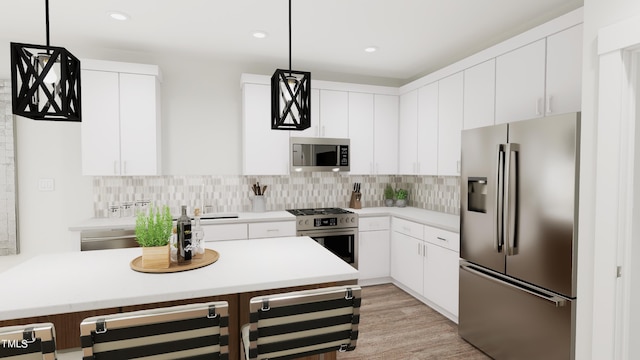 kitchen featuring white cabinetry, stainless steel appliances, backsplash, and pendant lighting