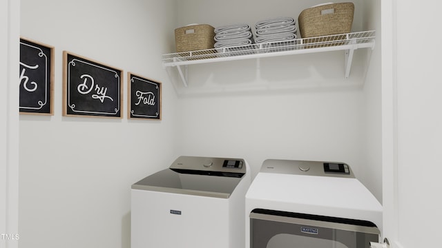 laundry room with washing machine and dryer