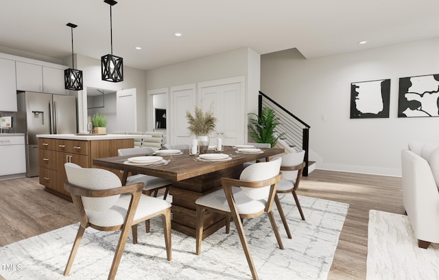 dining area with light hardwood / wood-style floors