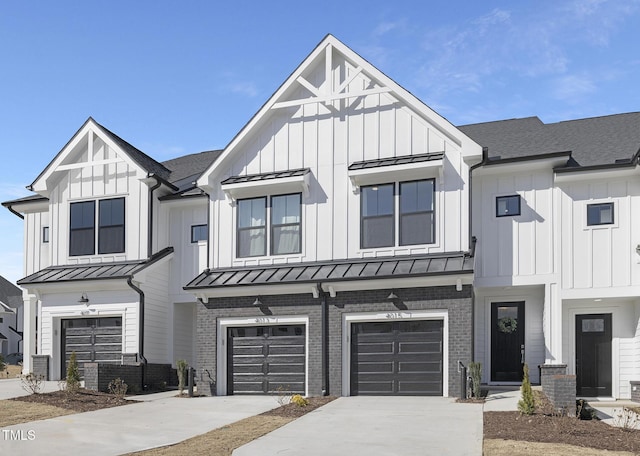 view of front facade with brick siding, a standing seam roof, and board and batten siding