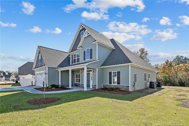 view of front of property with a porch, cooling unit, and a front lawn