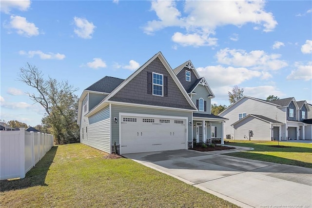 view of front facade with a front yard and a garage