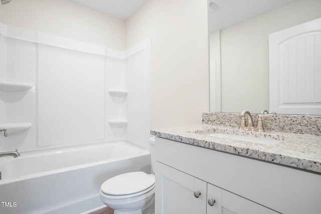 full bathroom with vanity,  shower combination, and toilet