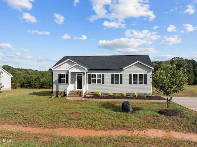 view of front of home with entry steps, concrete driveway, a front yard, roof with shingles, and crawl space