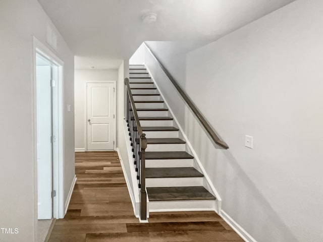 stairs with wood-type flooring