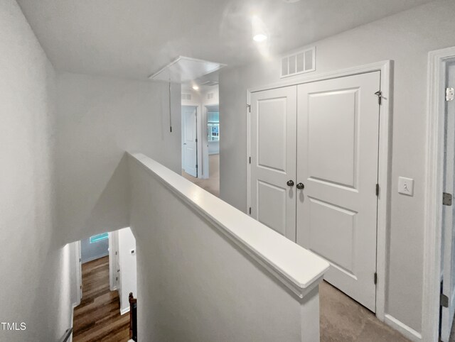 corridor featuring hardwood / wood-style floors